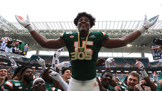 Sep 21, 2019; Miami Gardens, FL, USA; Miami Hurricanes defensive lineman Gregory Rousseau (15) celebrates wearing the turnover chain during the first quarter of a football game against the Central Michigan Chippewas at Hard Rock Stadium. Mandatory Credit: Sam Navarro-USA TODAY Sports